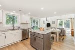 Open kitchen, dining, and living with tons of natural light 