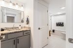 Main level full bathroom with a shower tub combo 