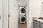 Main level bathroom leads into the laundry room 
