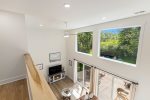 Soaring ceilings in the living space bring in all the sunlight 