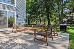 Both dining and relaxing outdoor furniture are in this space 