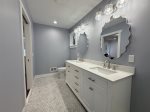 Upper level full bathroom with double vanity and walk in shower 
