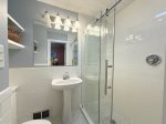 Main level primary ensuite bathroom with walk in shower 
