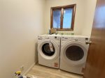 Main level laundry room with new washer and dryer