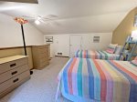 Third level lofted bedroom with two twin beds