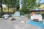Wonderful patio area with fire pit, outdoor dining, bbq grill, and hot tub