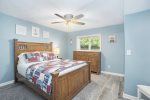 Lower level queen bedroom with partial lake views 
