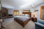 Cozy up by the fireplace in the fabulous master bedroom.