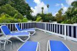 2nd story topless sunbathing deck over looking pool and gardens