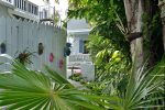 Lush, tropical, orchid filled gardens leading to Family House