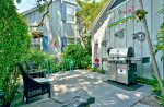 The bike rack, Shared Weber Gas Grill, chairs to enjoy while BBQing