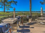 The grilling and picnic area is located beside the pool at Beachside Tennis