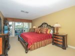 The Master bedroom in 1839 Beachside Tennis has a King bed and acees to the balcony