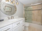 Guest Bath with Hall Access Offers a Shower/Tub Combo and Quartz Marble Counter Tops at 2403 Island Club