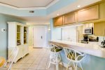 Dining Area and Kitchen with Breakfast Bar in 2115 Windsor II