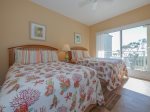 The Guest Bedroom with Deck Access at 5303 Hampton Place has 2 Double beds and New Hardwood Floors