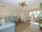 Spacious Living Room at 5303 Hampton Place has access to the balcony overlooking the landscaped grounds out to the Atlantic Ocean
