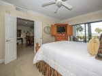 Master Bedroom with Private Deck Offering Views of Pool and Calibogue Sound at 1848 Beachside Tennis