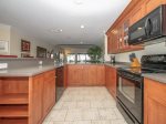 Newly Renovated Kitchen with Water Views at 1848 Beachside Tennis