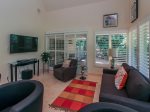 Second Living Area off of the Kitchen in 3 Marsh Island has comfortable seating and a large flat panel TV