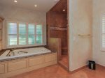 Master Bathroom features a large tub and separate shower in 3 Marsh Island