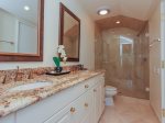 The private bathroom off the King Guest bedroom features a double vanity and large shower in 3 Marsh Island