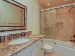 The third guest bedroom also has a private bathroom with a shower/tub combo - 3 Marsh Island Road