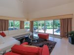 The open Living Area at 3 Marsh Island Road in Sea Pines offer beautiful views of the pool and lagoon