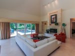 Living Area at 3 Marsh Island Road in Sea Pines has a flat panel TV in the corner cabinet
