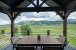 Dine al fresco on the covered deck with incredible views