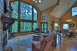 Spacious Living Area with vaulted ceilings and a view of the river