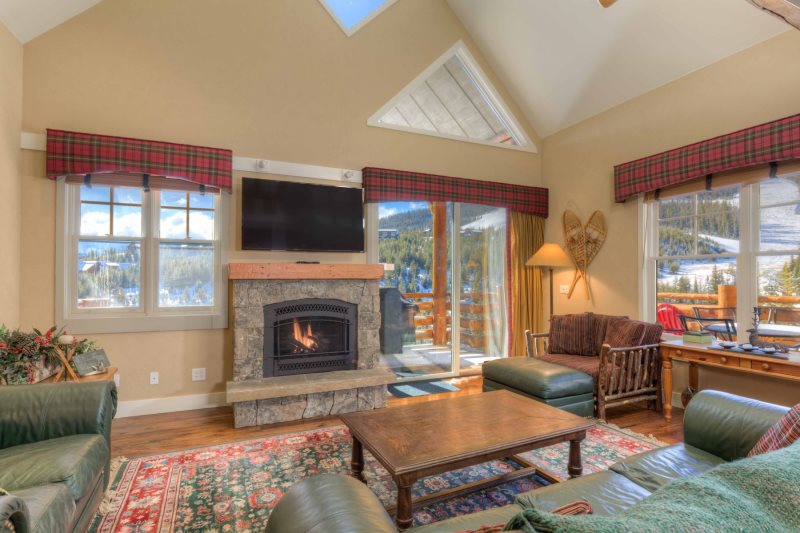 Saddle Ridge Vacation Als Big Sky Ski In Living Room With Lone Peak Views Stone Fireplace Vaulted Ceiling Hardwood Floors And Plenty Of Seating