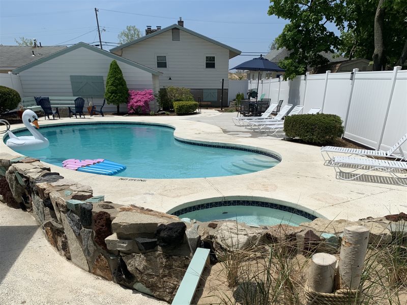 Pool that looks like a beach in your backyard
