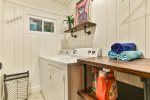 Laundry room with full sized washer and dryer.