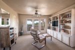 Master bedroom study in bedroom with balcony doors