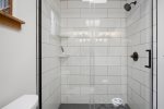 Full bathroom, standing shower with a glass enclosure