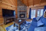 Cardinal Creek-Living Area with Fireplace and large flat screen tb
