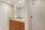 The guest bathroom is located adjacent to the living room and provides added space to get ready for the day