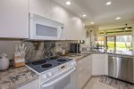 The kitchen features granite countertops, updated appliancesincluding a refrigerator, freezer, oven, stove, microwave and dishwasher