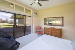 This inviting space features wrap-around windows, a king-size bed, bedside tables, AC, a dresser and a lounge chair for quiet moments of relaxation