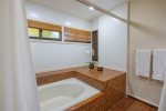 Enjoy an oversized soaking tub and shower