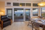 Just off the living room, the large, covered lanai becomes an outdoor living room of its own