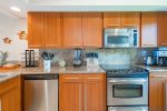 Fully equipped with all major appliances, including stove, oven, dishwasher, microwave, refrigerator, and freezer, the kitchen comes fully stocked with everything needed to prepare and serve the finest of meals at home