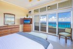 A king bed, wrap-around windows, ceiling fan, air conditioning, and flat-screen TV provide comfort and ease