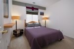 The third bedroom features a queen bed and shares the hall bath
