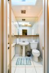 The bathroom adjoins with the second bedroom and is shared with the other bedrooms