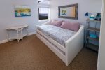 Second sleeping area offers a trundle bed with two twins