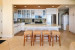 Kitchen island offers 4 bar height stools