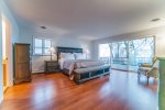 Master bedroom with King bed and glass doors to the deck