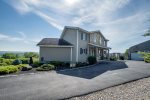 Front entry and paved driveway to the house